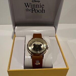 NWT Disney Winnie the Pooh Wrist watch with Goldtone Face and Analog movement.